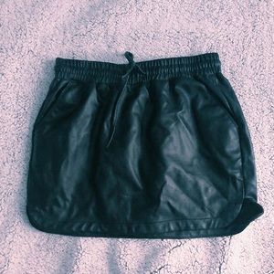 prettylittlething black leather tie mini skirt